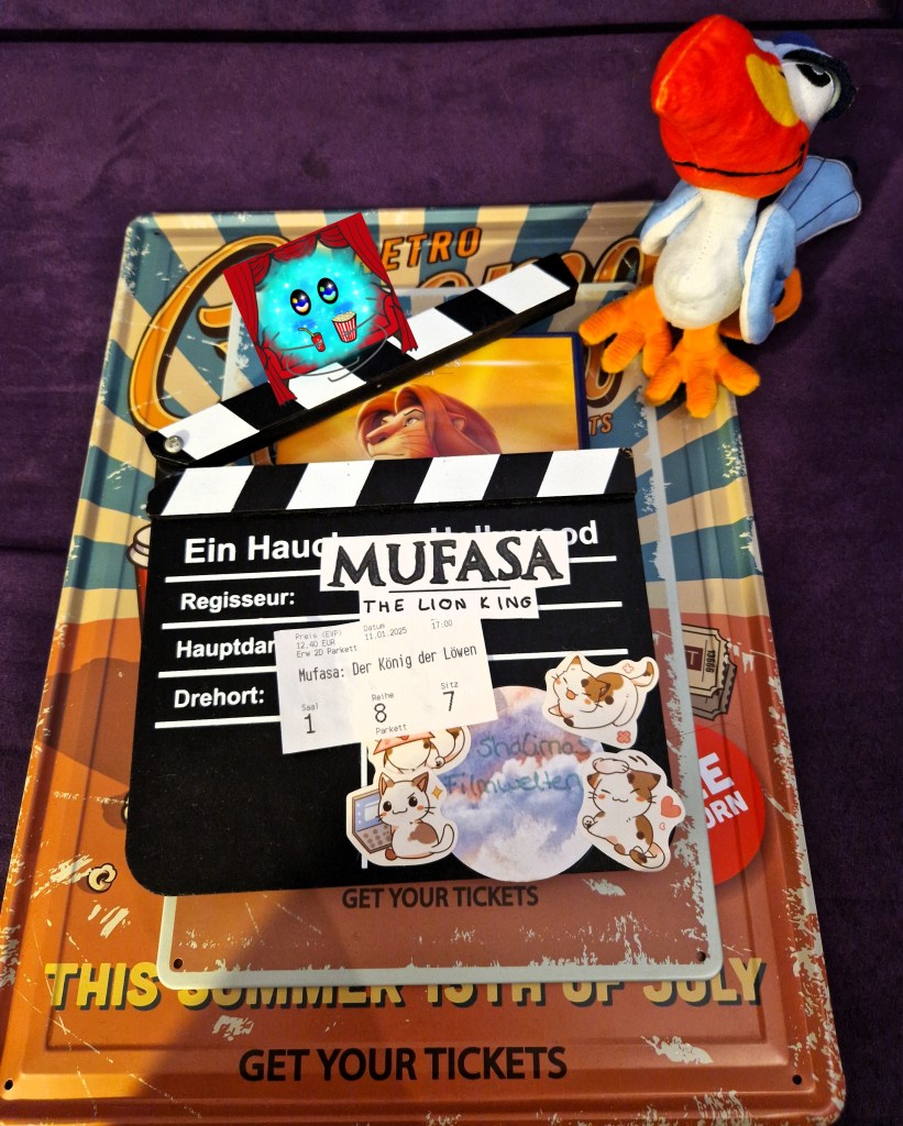 Filmtitel und Kinoticket auf Filmklappe mit Zazu-Plüsh
