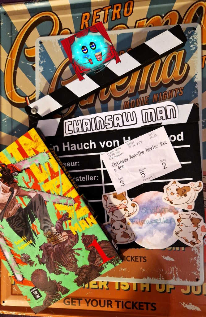 Fanart des Filmtitels auf einer Filmklappe mit erstem Mangaband im unteren Bildrand