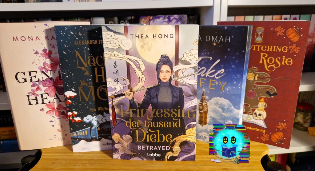 Die im Beitrag genannten Bücher voreinander arrangiert. Im Hintergrund steht ein Bücherregal